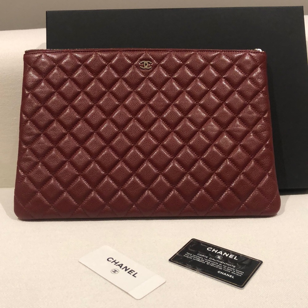 CHANEL Quilted Burgundy Leather Clutch with Gold CC